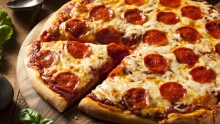 1 Πίτσα επιλογής + 1 Σκεπαστή Γλυκιά Pizza επιλογής